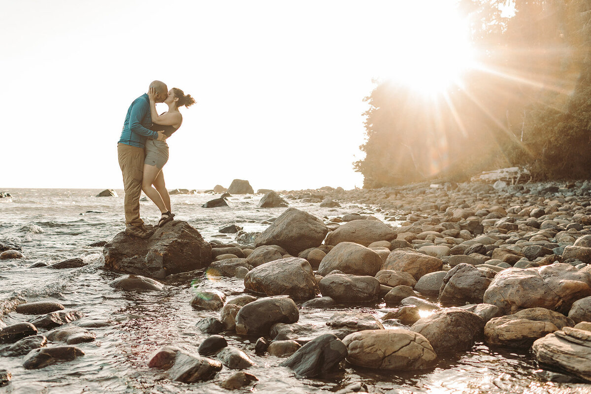 Utah Wedding Photography capturing couple standing on rocks during outdoor portraits