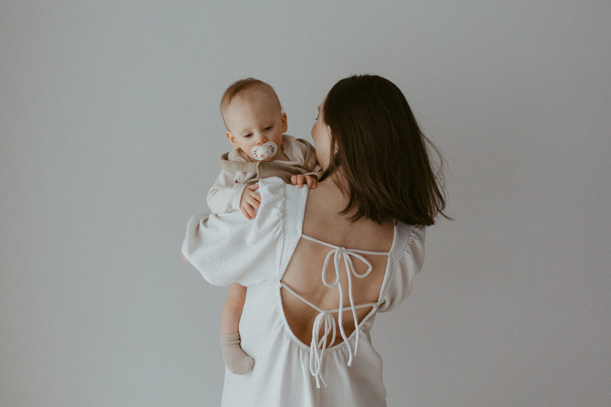 Mother holding her child at home in Helsinki