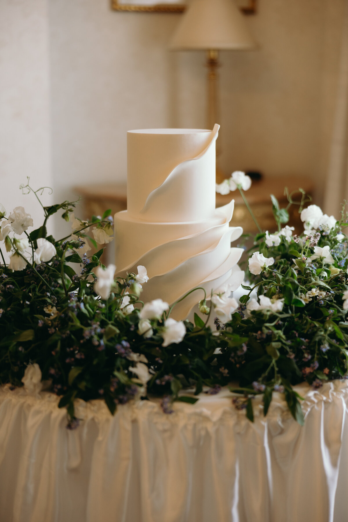 Cake surrounded by fresh flowers