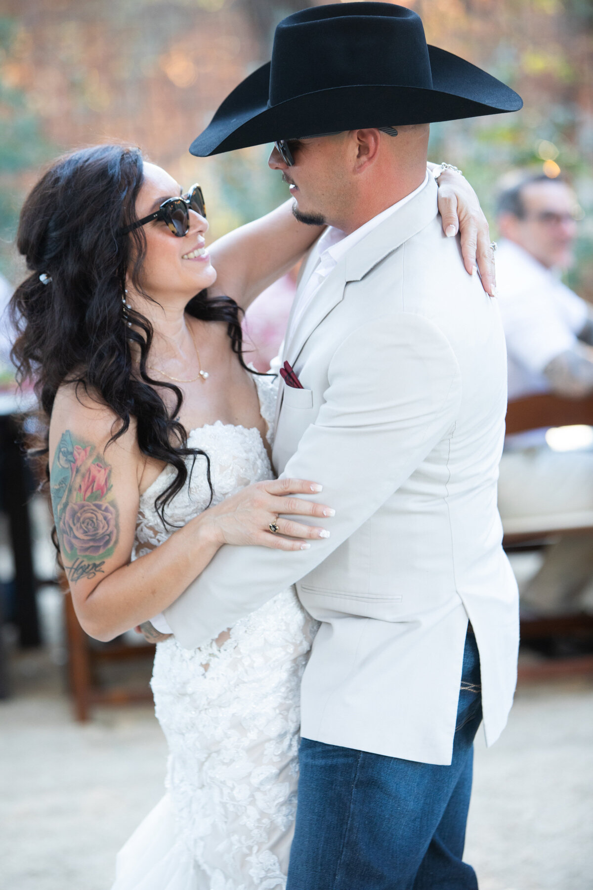 bride and groom first dance with sun glasses