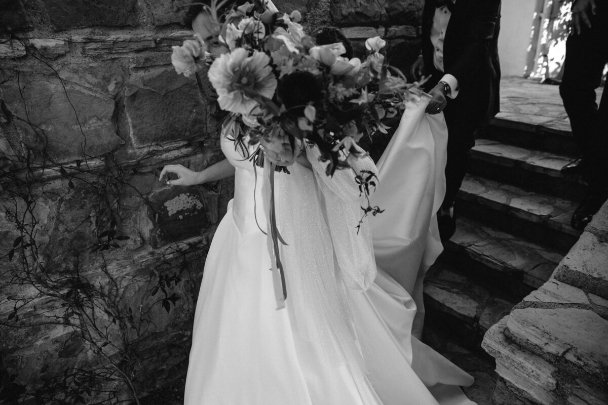 Black and white image of a bride holding a bouquet