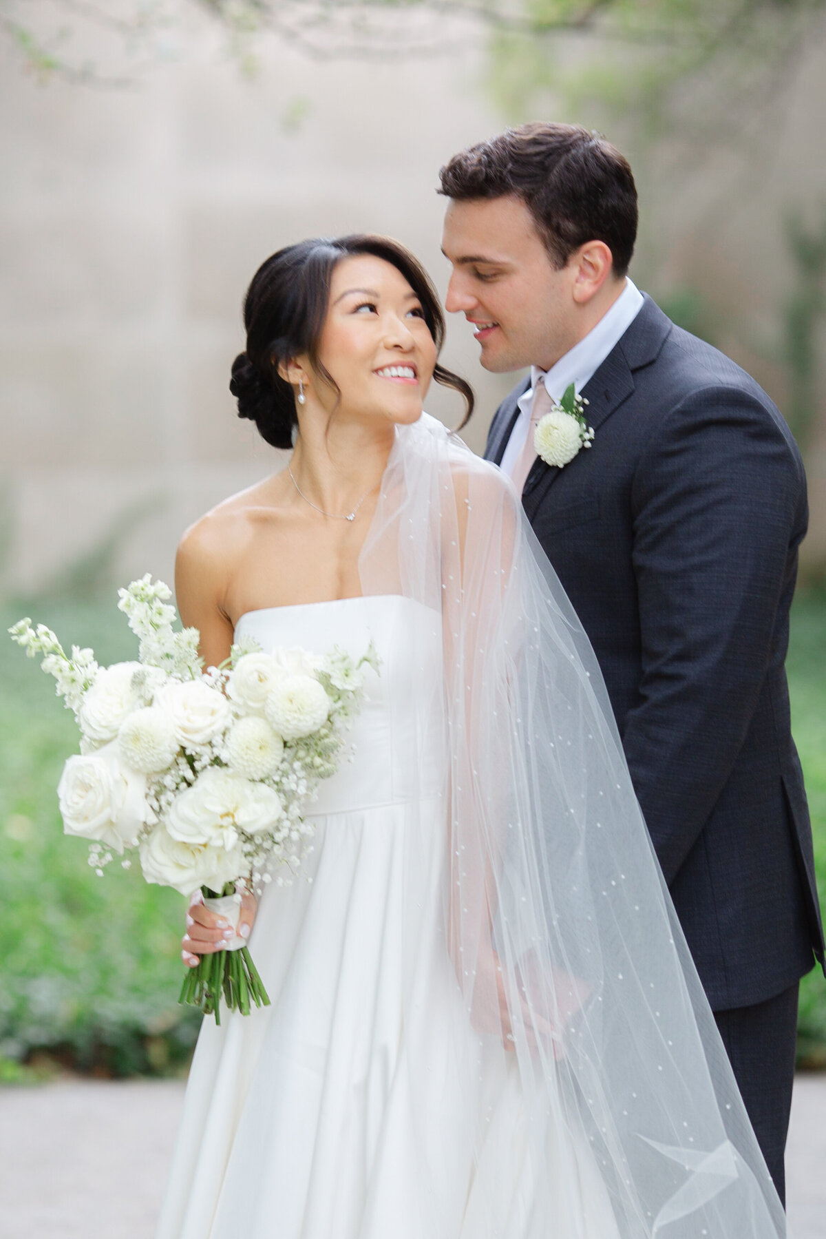 An Asian bride with her husband on their wedding day