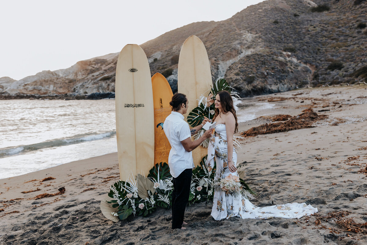Destination elopement photographer capture bride and groom during beach elopement ceremony