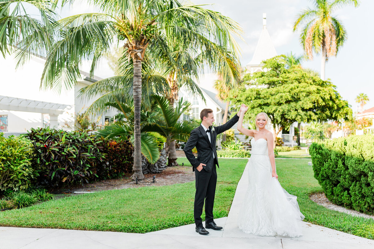 Groom twirls bride at their Sarasota Florida  Wedding
