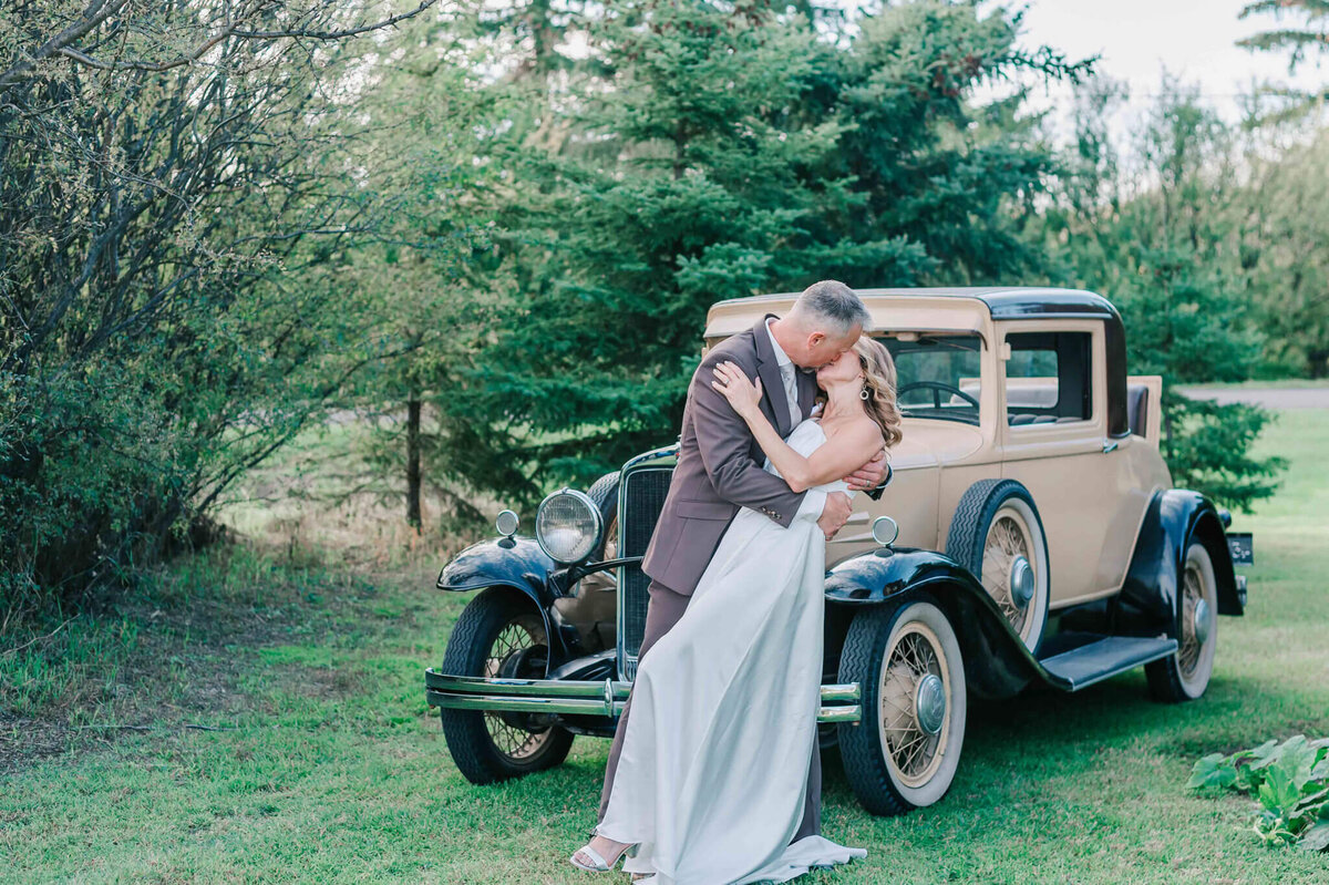 Bride and groom sharing a kiss.
