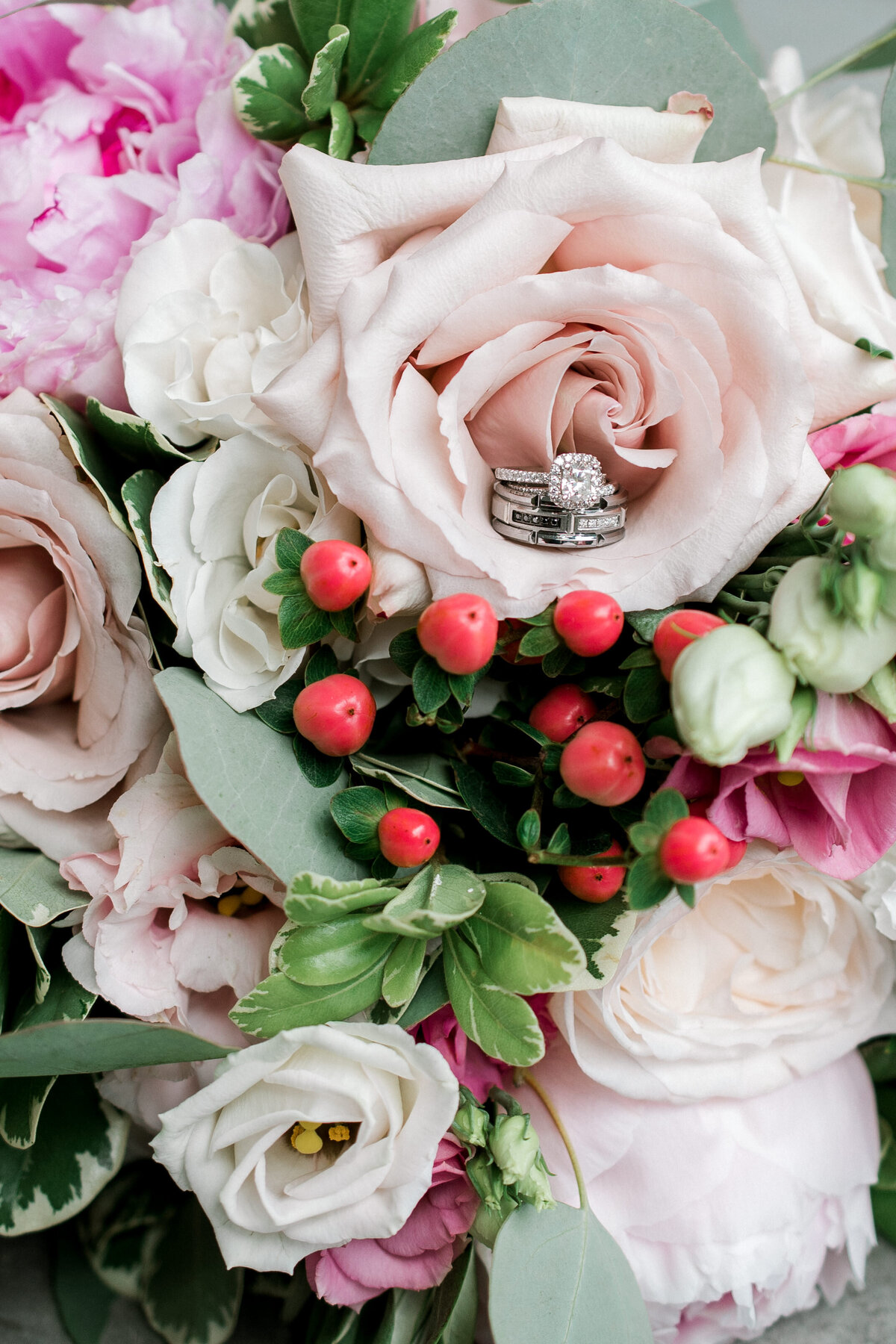 Close shot of wedding ring in flower bouquet