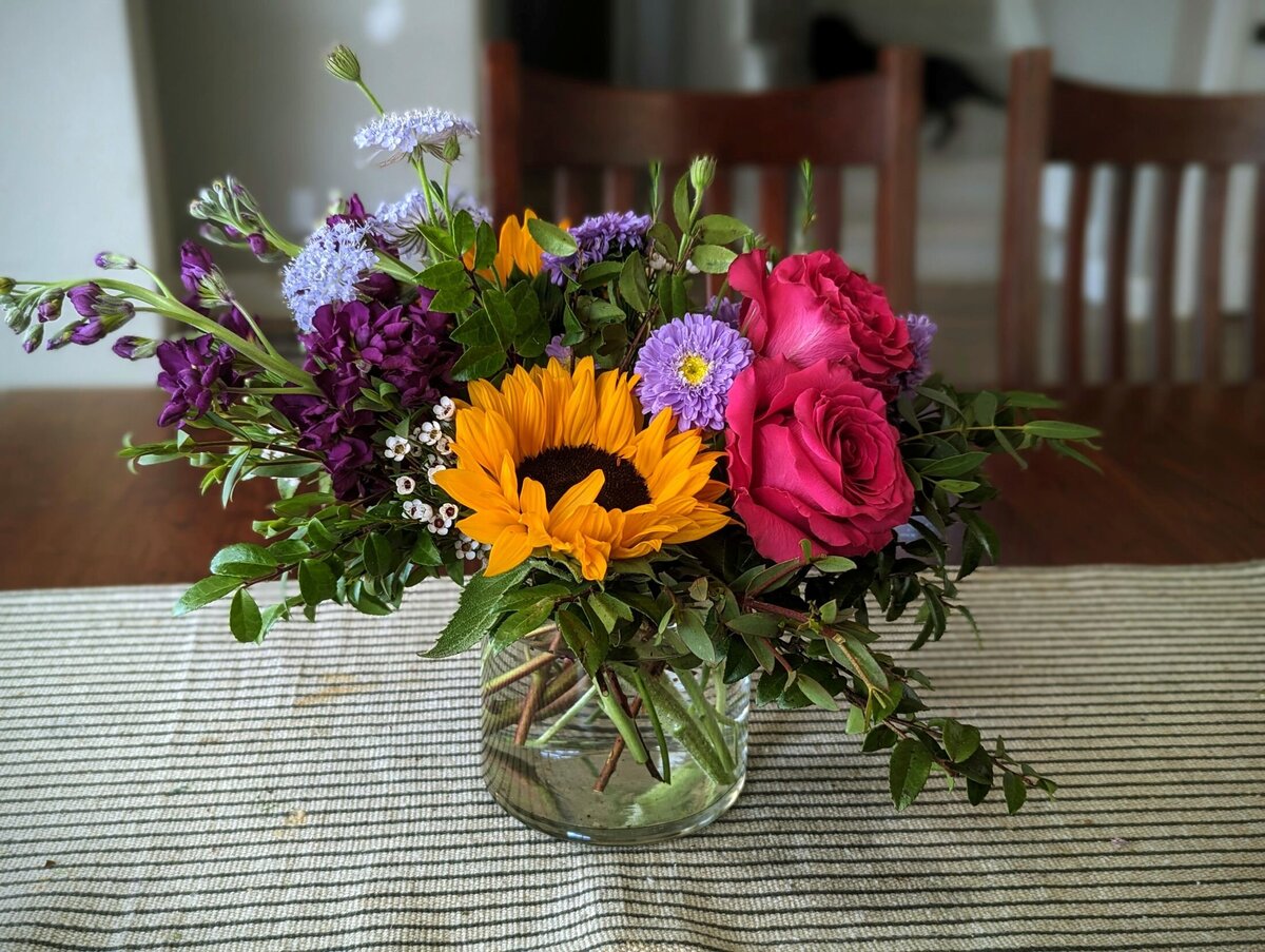 bright funeral flowers vase