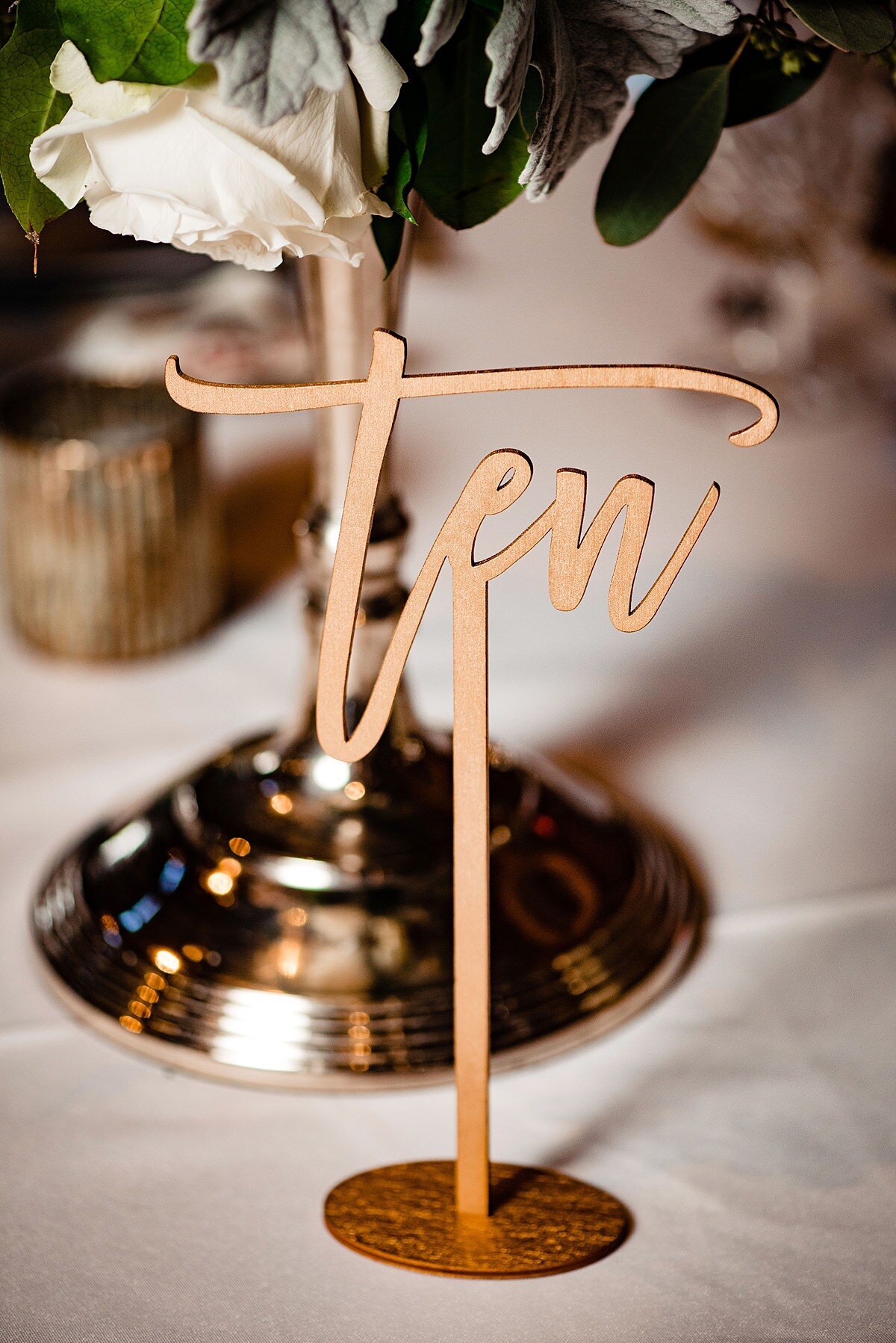 Laser cut wooden table number on stand for a wedding reception at Sycamore Farms