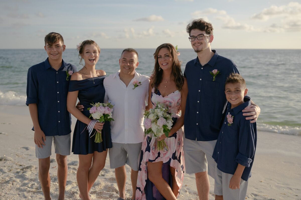 Family at beach wedding