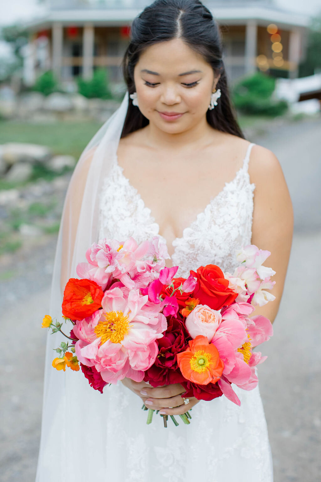 Bride in Maine holding colorful bouquet