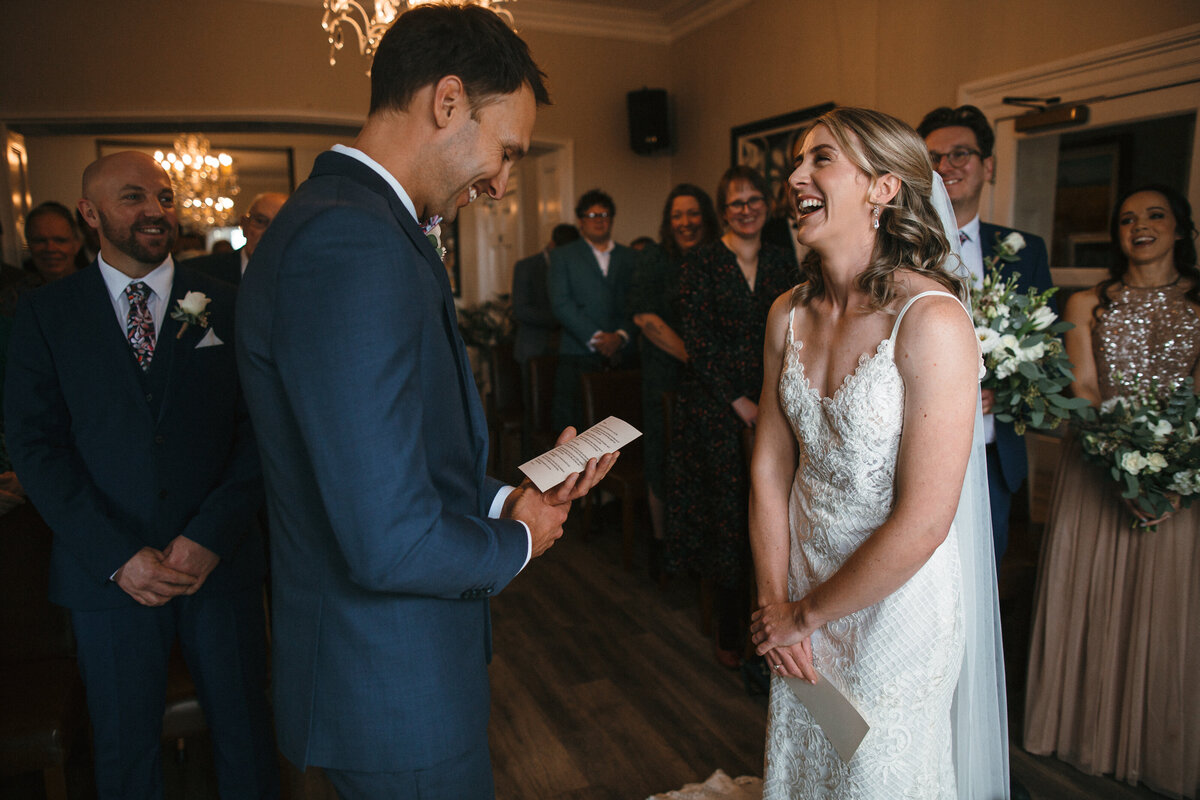 Winter wedding ceremony at Buckland Tout Saints in Devon