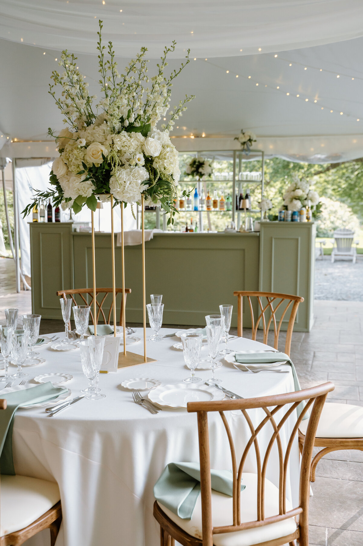 sage flex bar, sage pedestals, white fabric swags, small white lights, sage back bar