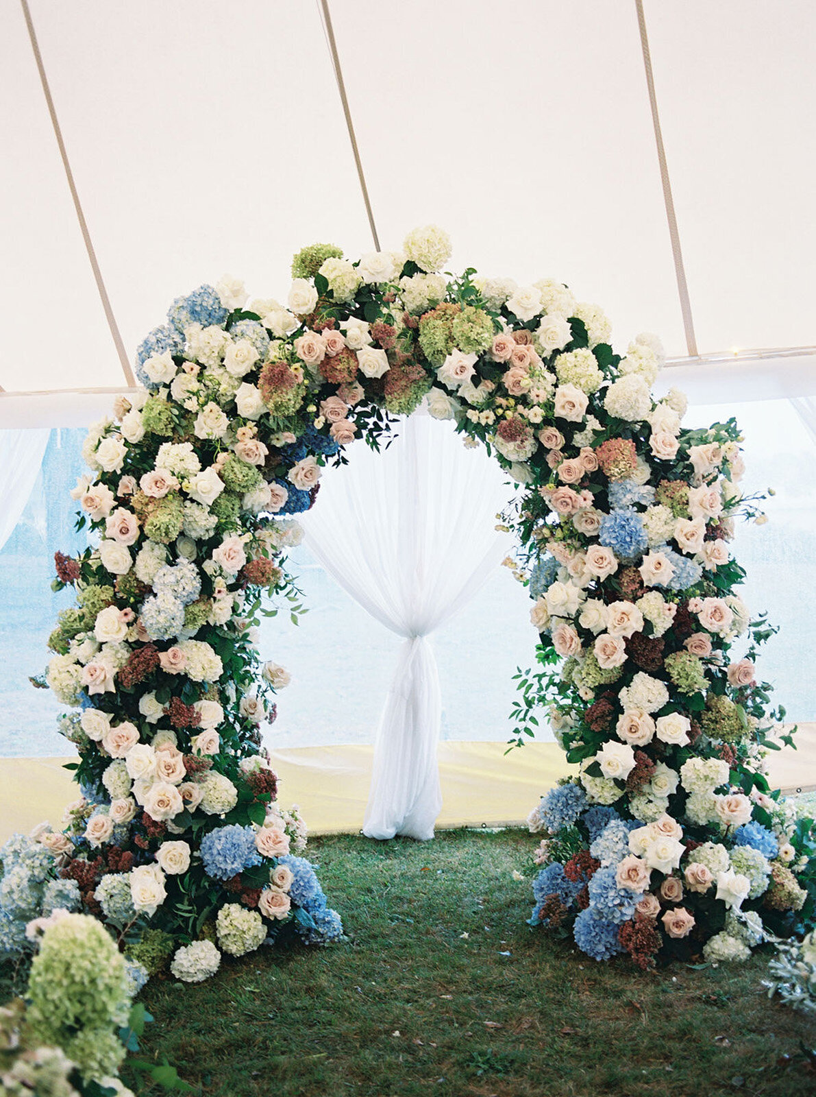 Kate_Murtaugh_Events_Cape_Cod_tented_wedding_ceremony_arch