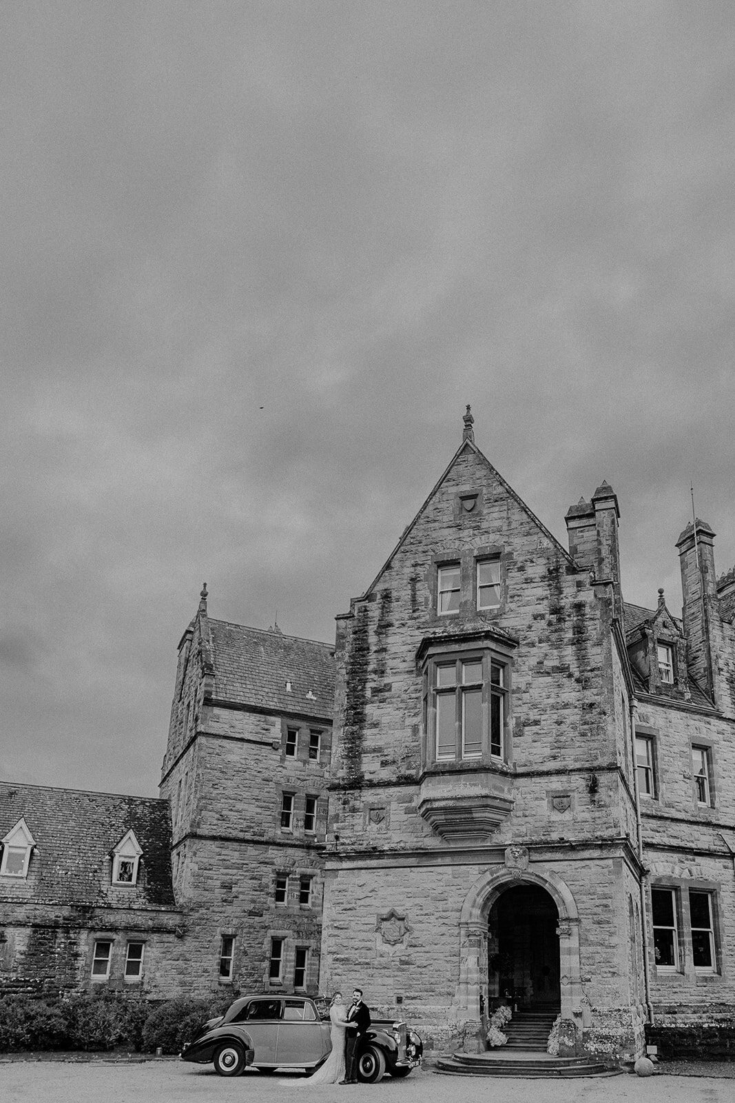 Bride and groom in front of the Castle in Leslie, Ireland