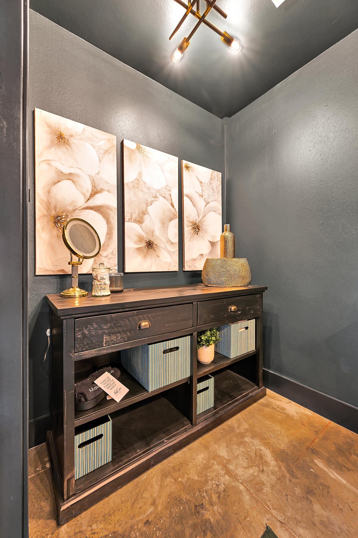 Bathroom with additional mirror in this top floor two-story industrial condo in the historic Behrens building with skyline views, fully stocked kitchen and room for 6 in downtown Waco, TX.