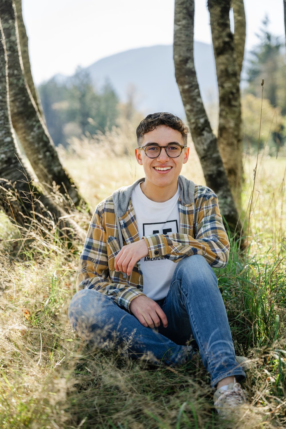 north bend high school senior guy sitting at park