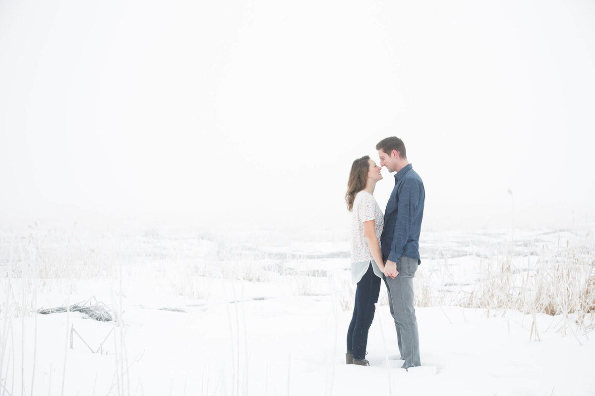 Engaged couple looking at each otehr during their frosty winter engagement session with las vegas wedding photography specialist