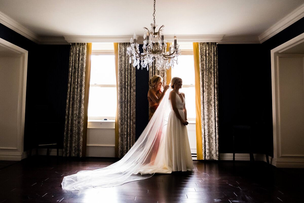 mom putting in bride veil in omni presidential suite
