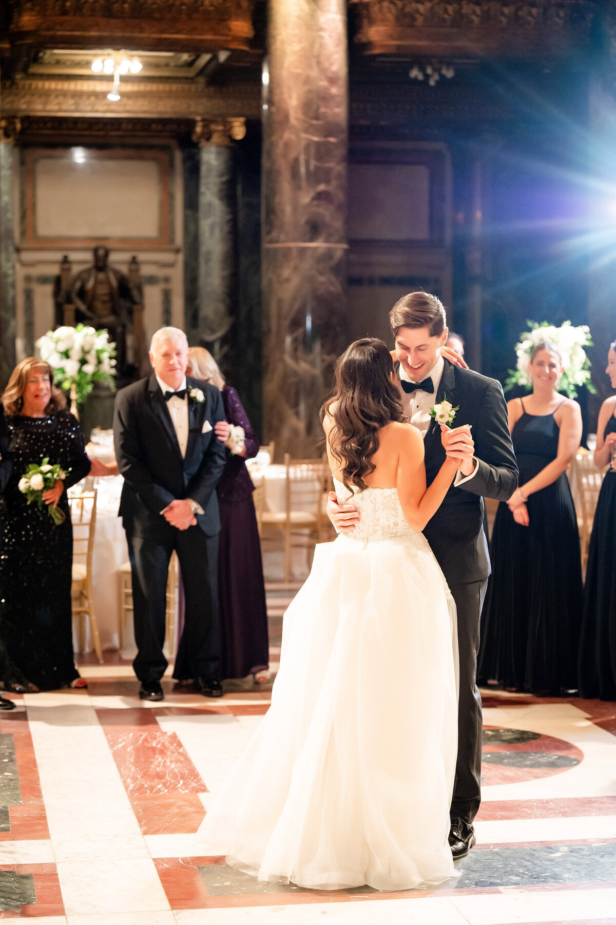 bride and groom dancing in wedding reception