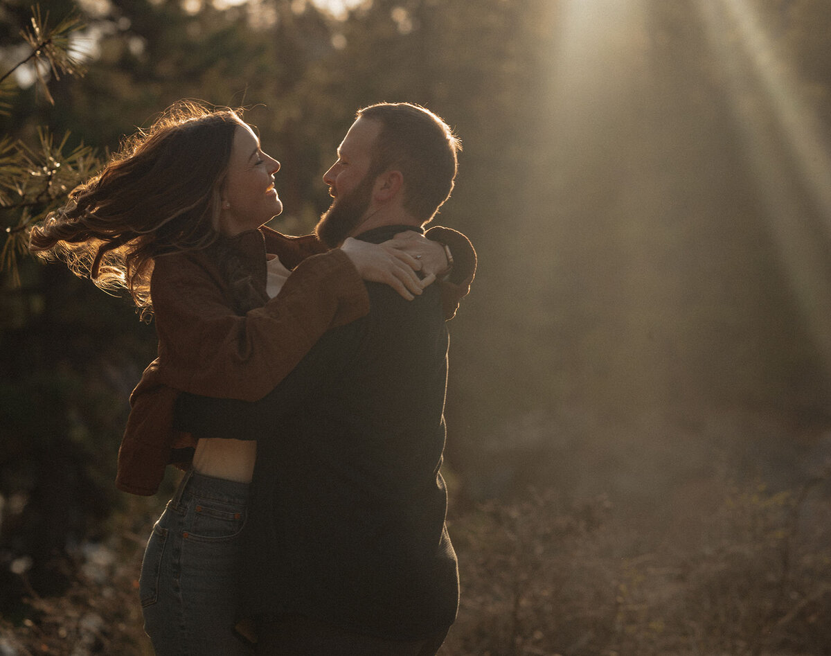 engagement couple having fun in the outdoors during an authentic and outdoor photoshoot in Bend, Oregon