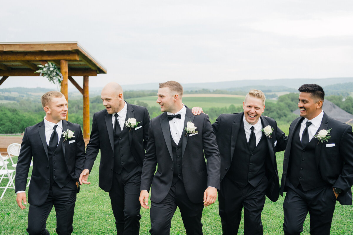 groomsmen-having-fun-company-stables