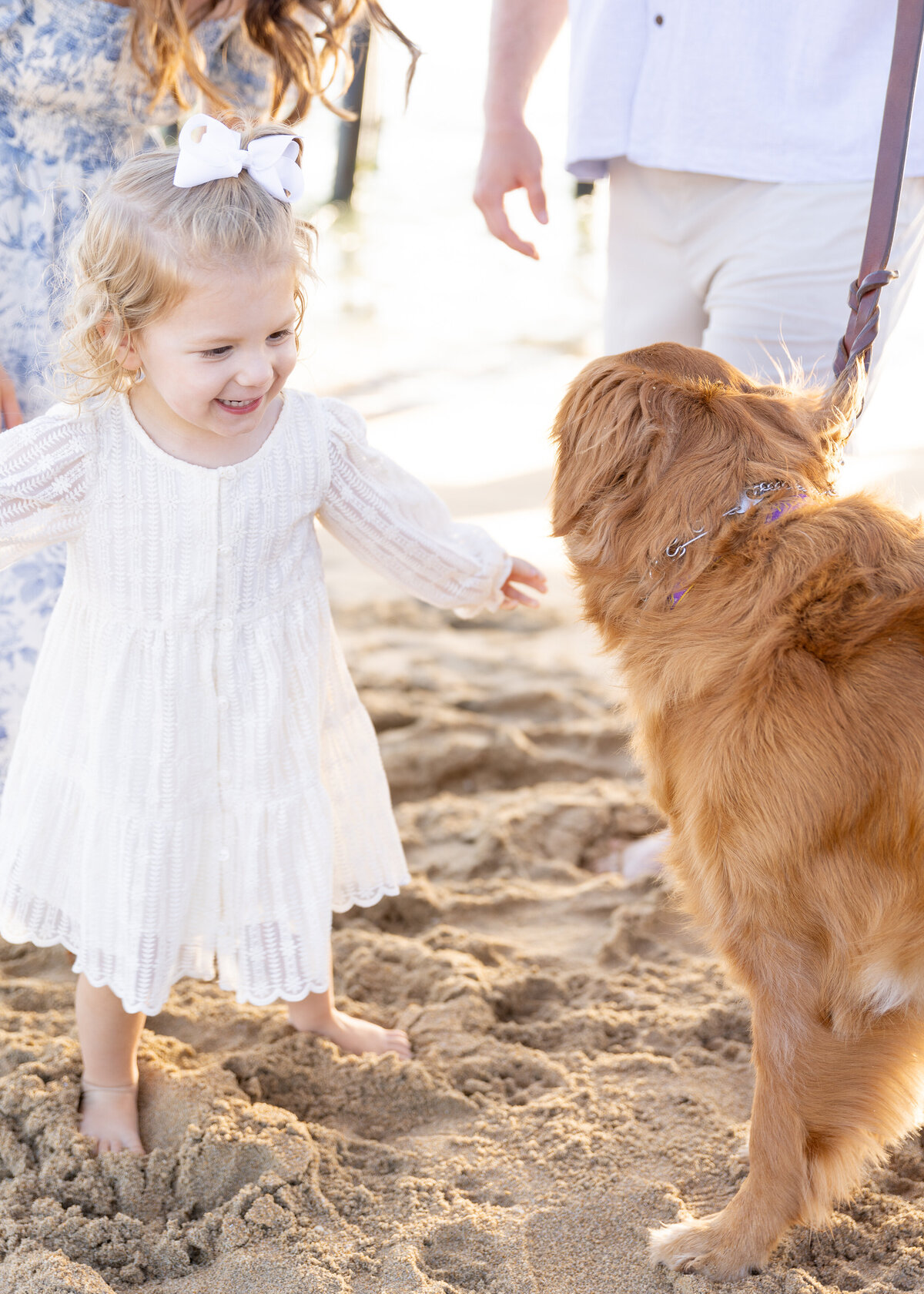 candid family photo with daughter and dog