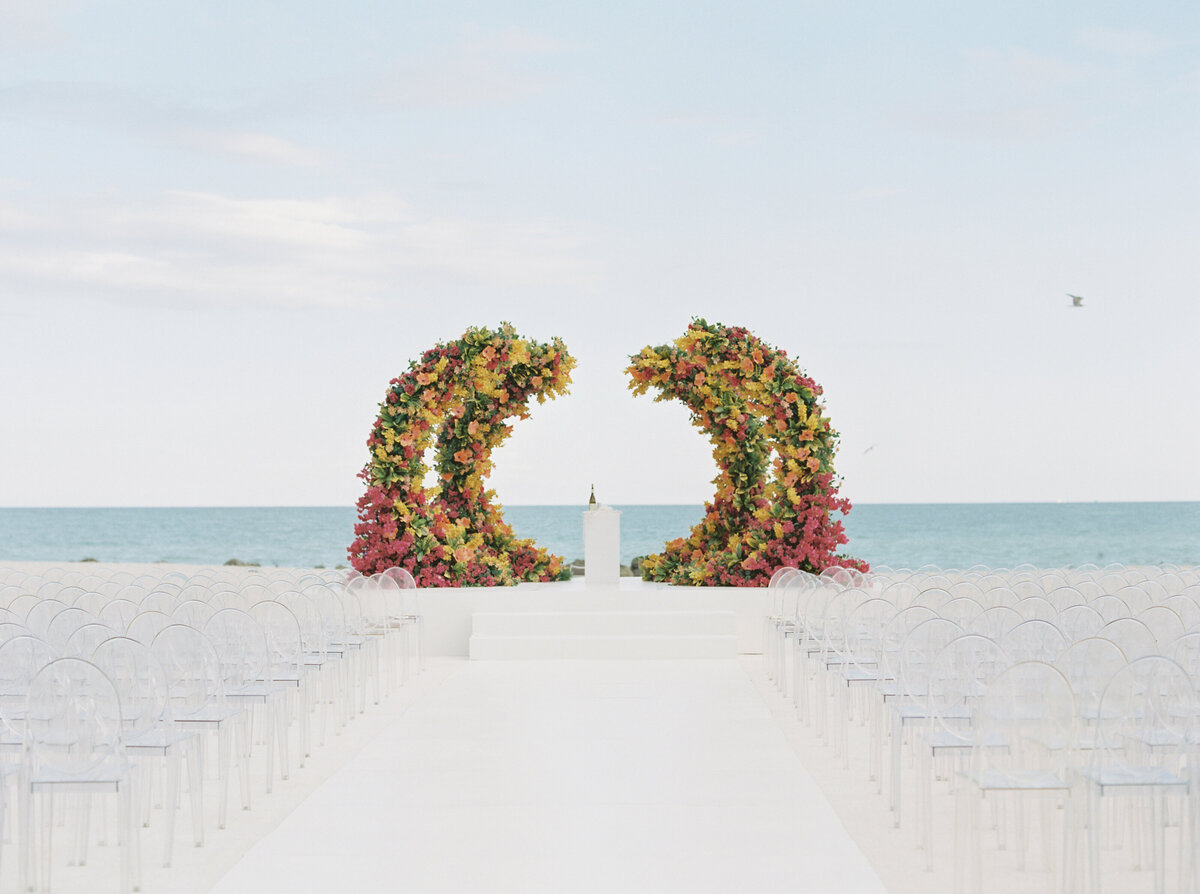 miami beach front wedding ceremony site with floral installation