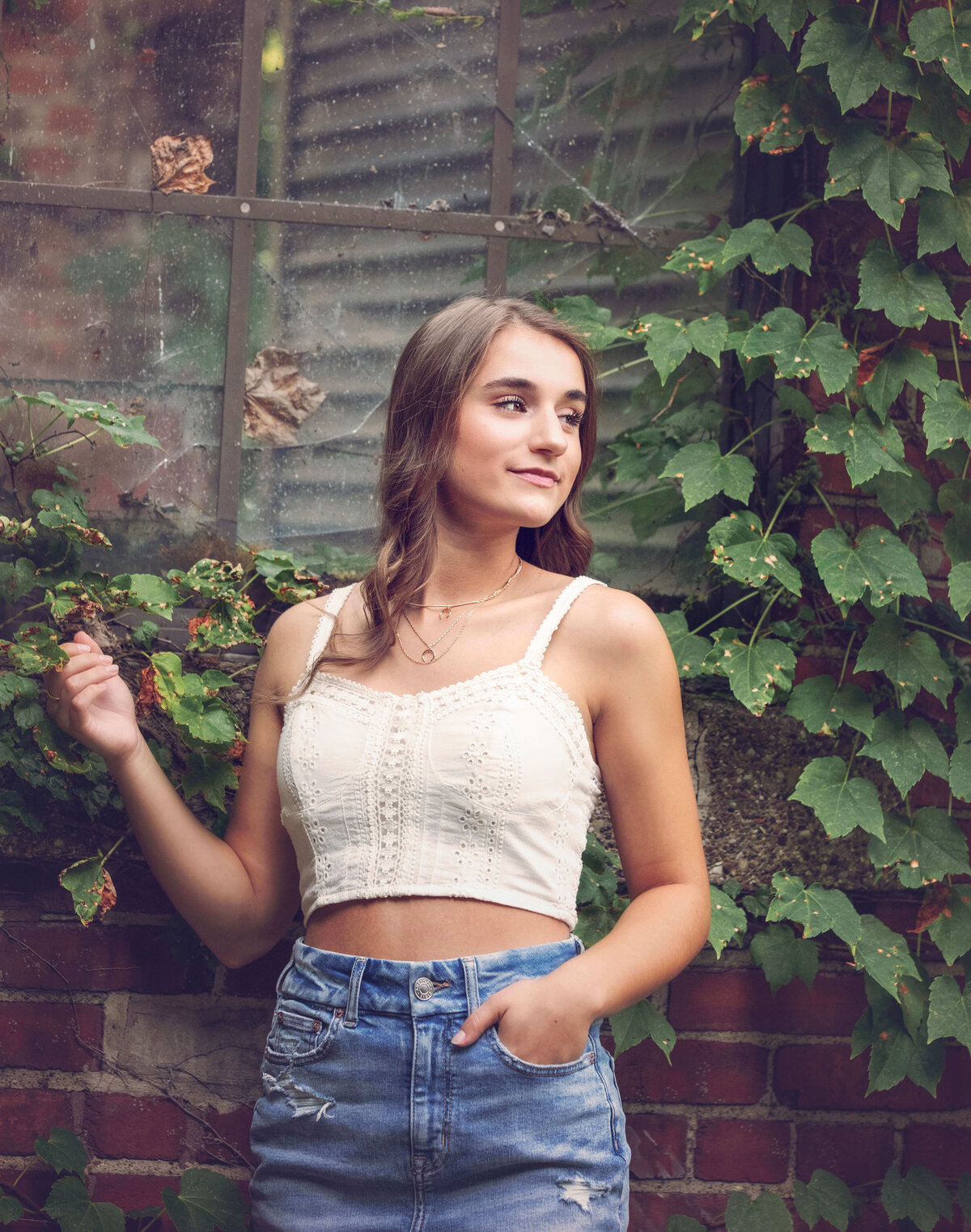 Senior photo in an Erie Pa courtyard in downtown Erie of a girl