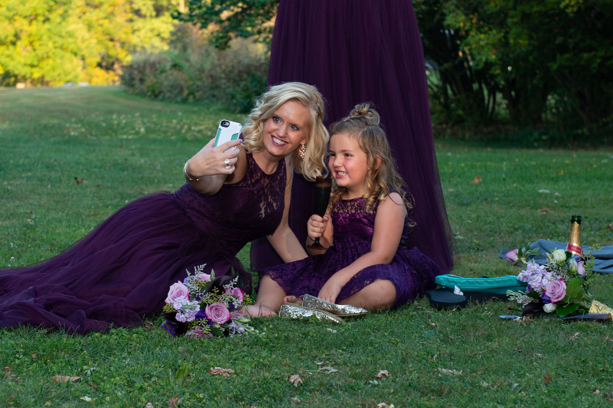 selfie on the lawn with purple dresses