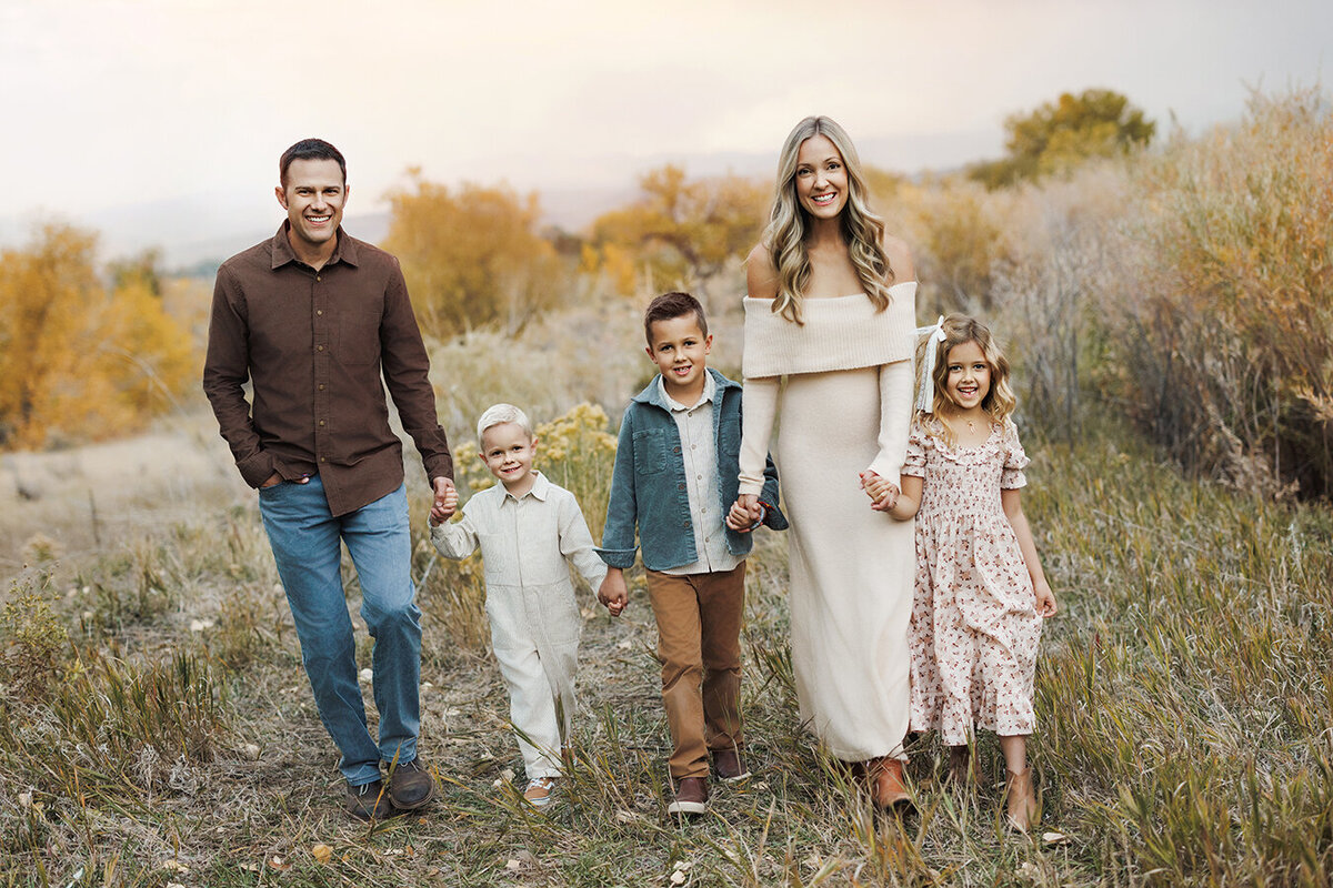Adorable Fort Collins family walking in the field for their photos