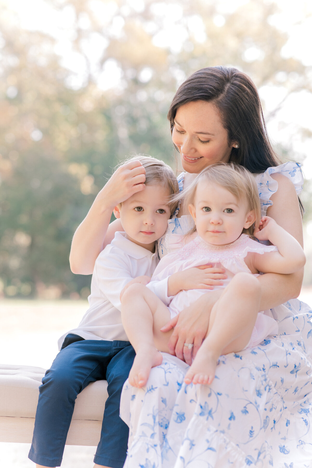 Mom sitting with her kids for a portrait in Texas park