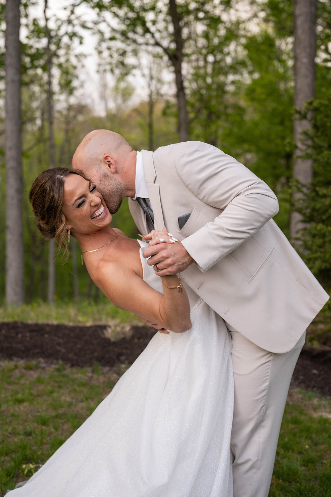 Vallosio-Photo-and-Film_groom-kissing-laughing-bride