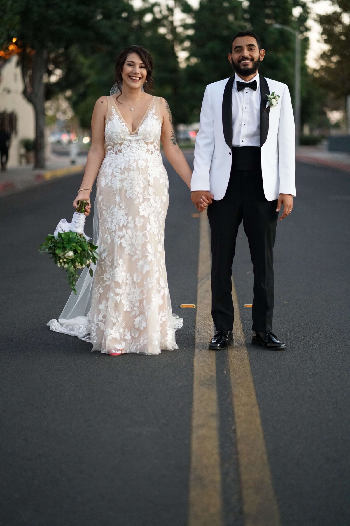 Newport Beach Wedding photographer bride and groom standing on road
