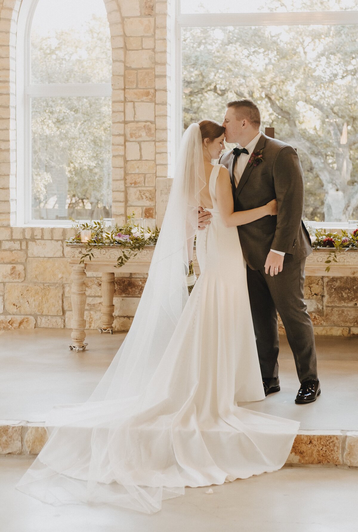 Newly married couple at the altar in the chapel of the french farmhouse in Collinsville | Photos by Meggie