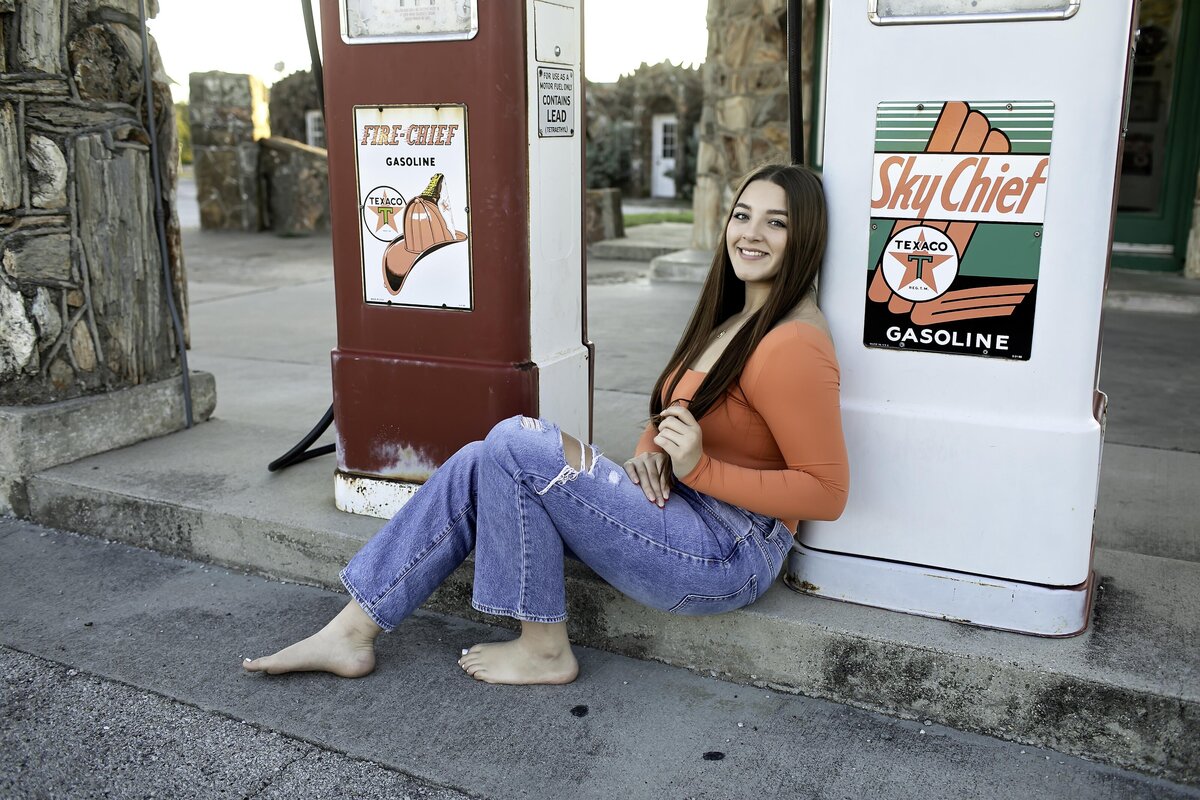 A high school senior strikes a relaxed pose, reflecting their calm and collected nature