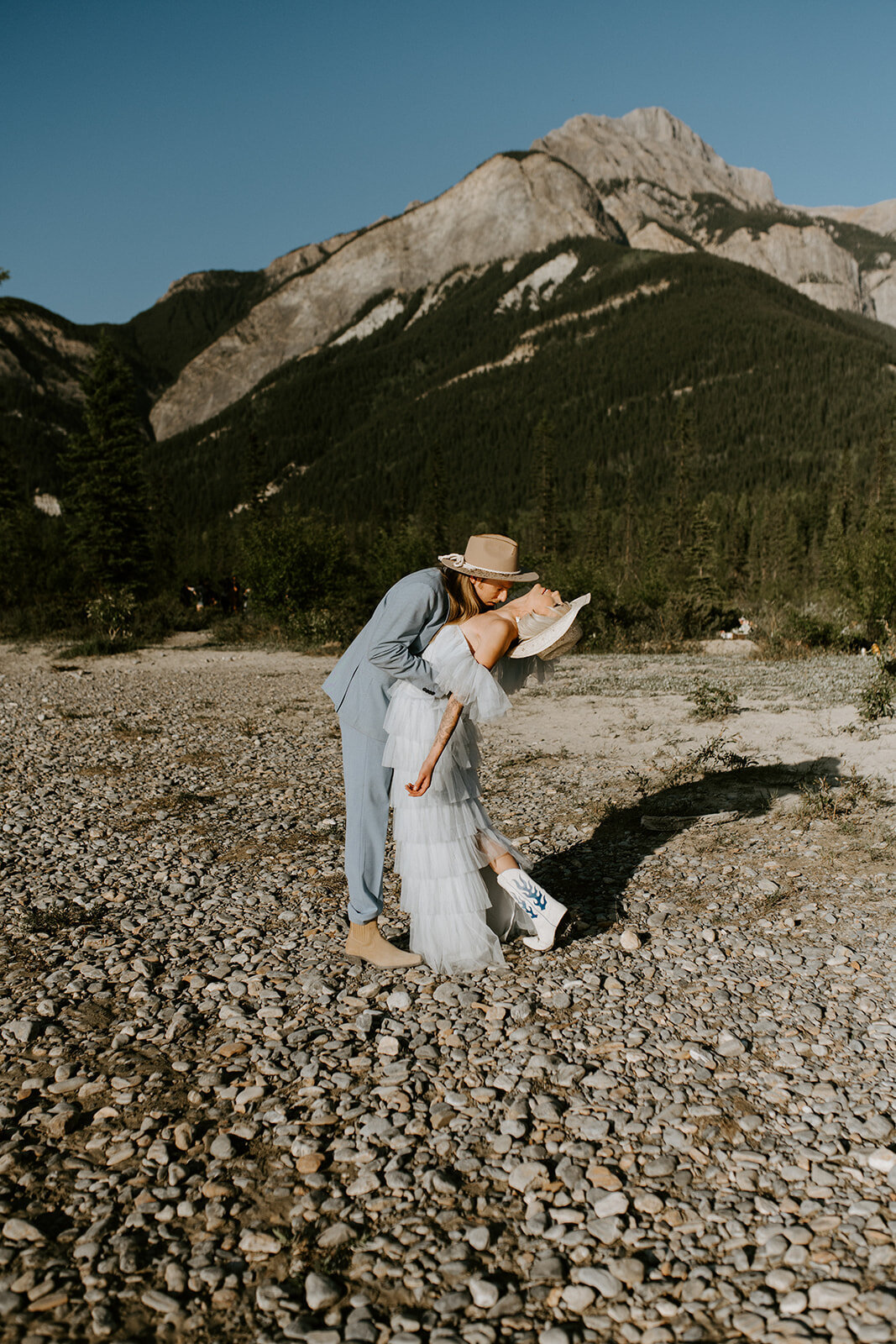 Groom-kisses-brides-neck