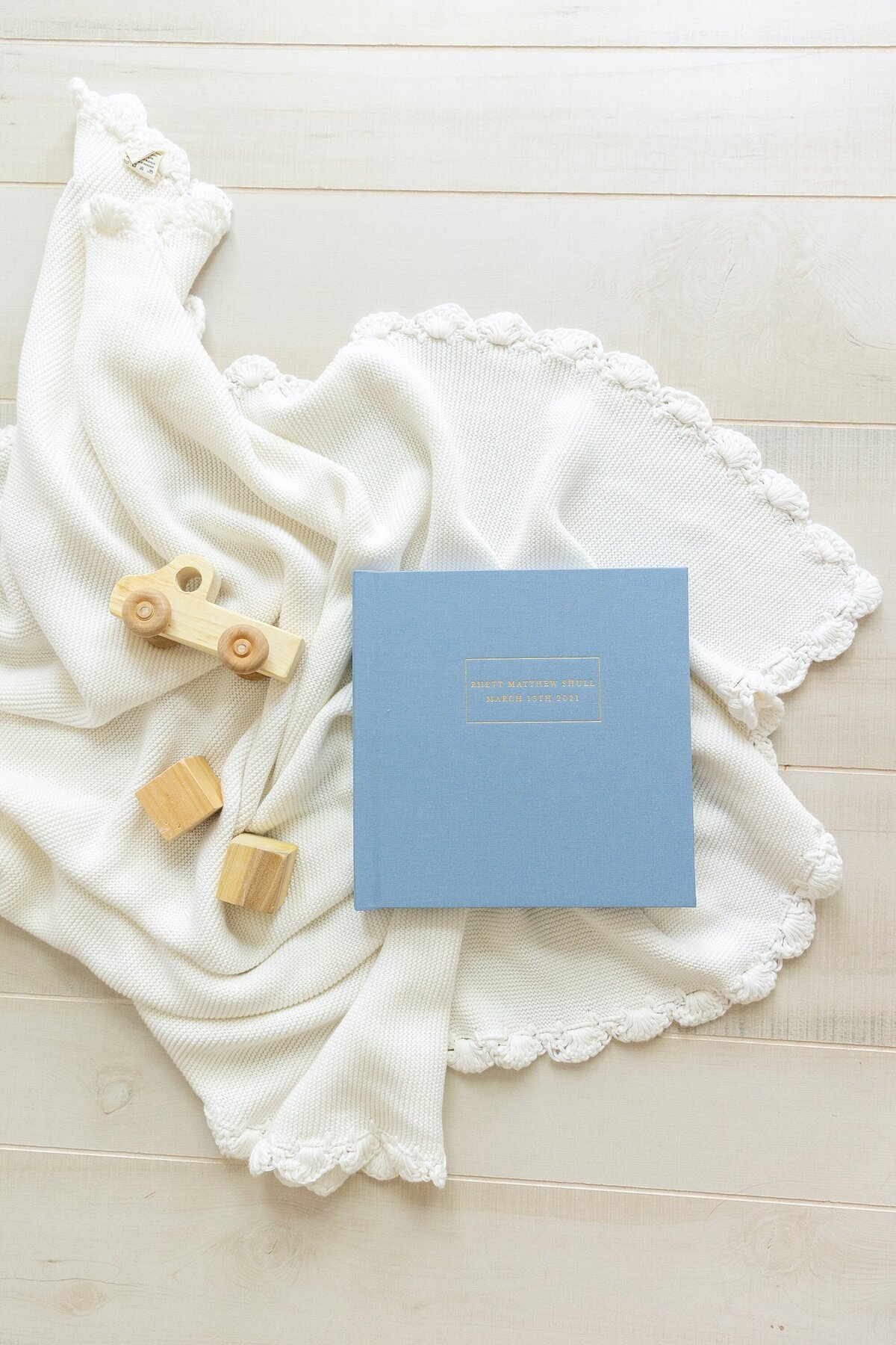 bright blue cloth baby album