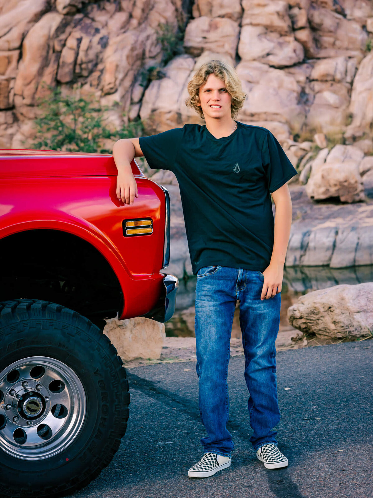 Boy leans on truck in Prescott senior photos