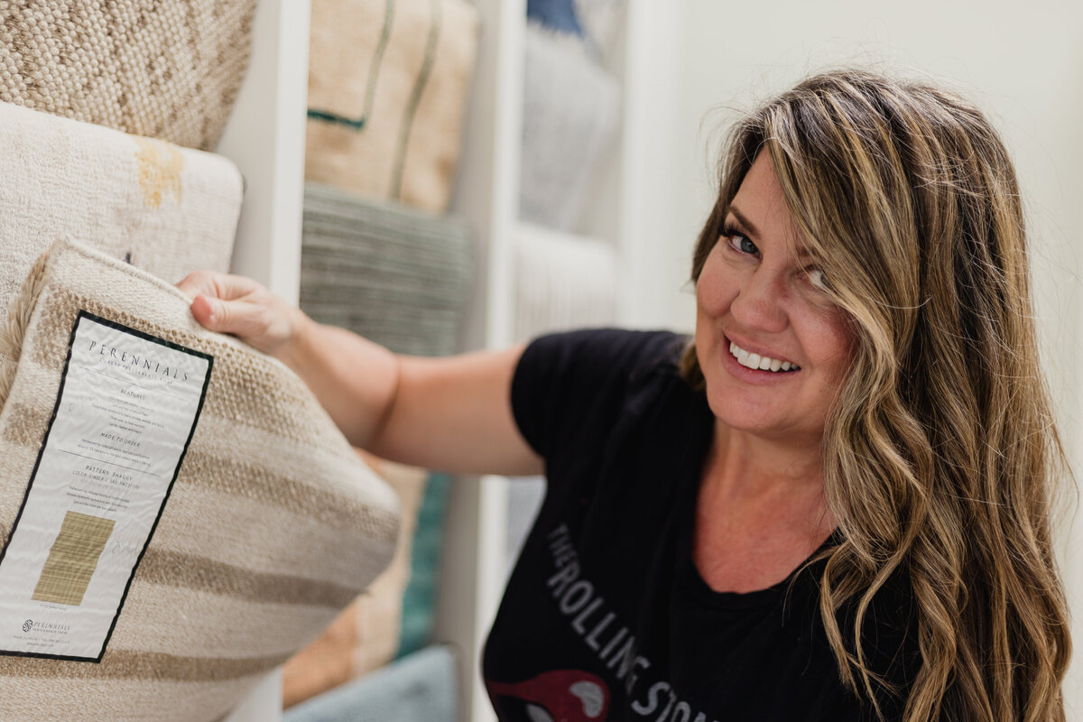 Interior Designer in showroom examining textiles