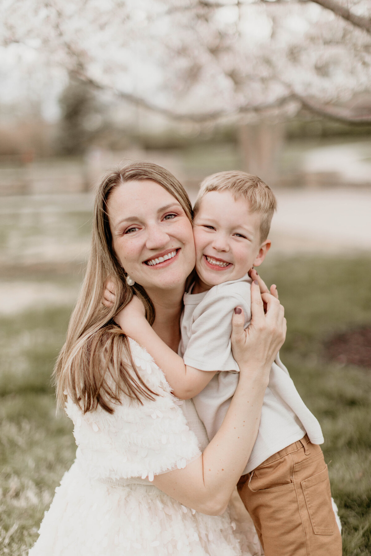 Mom in get embrace with oldest son. 