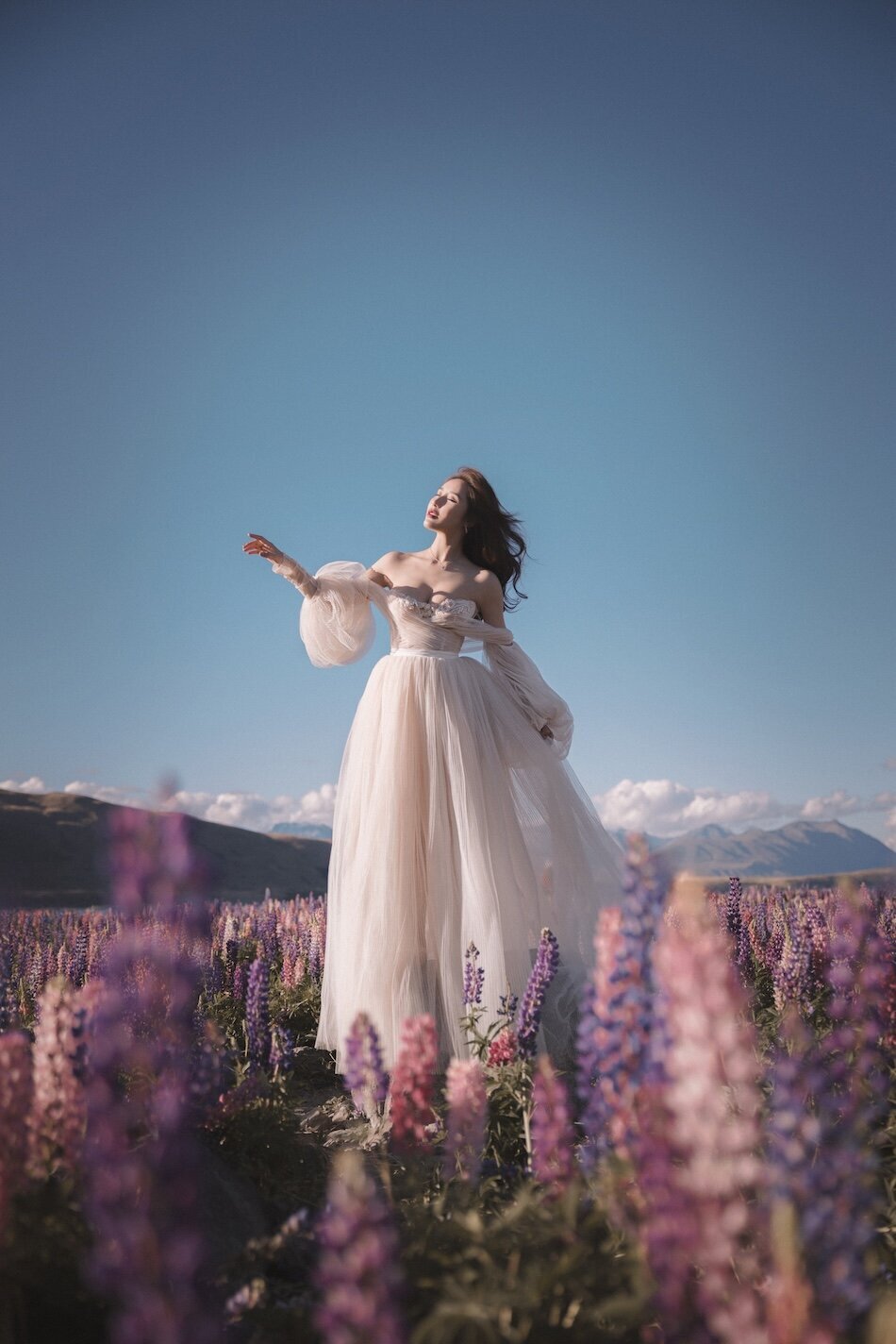 Pre-wedding photoshoot, the lupins, Lake Tekapo. Galia Lahav Haute Couture gown.