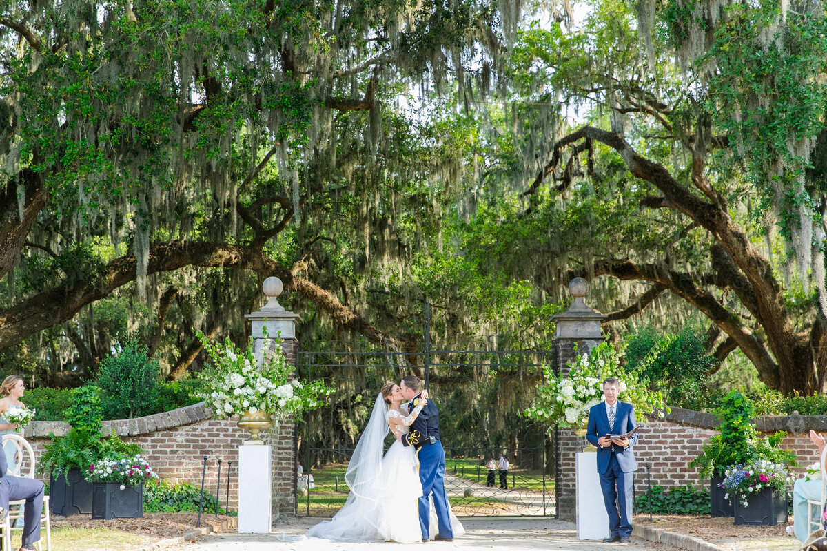 Bride and groom kissing at their Boone Hall Plantation elegant spring soiree wedding  |  Charleston wedding photographer Dana Cubbage Weddings