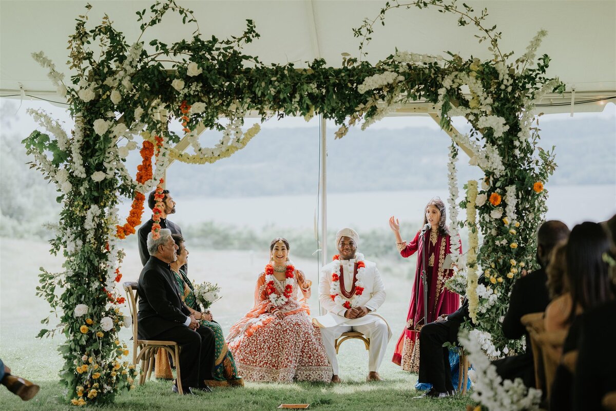 Indian Ceremony under a Mandap with greenery and flowers at Ankony Carriage House in the Hudson Valley