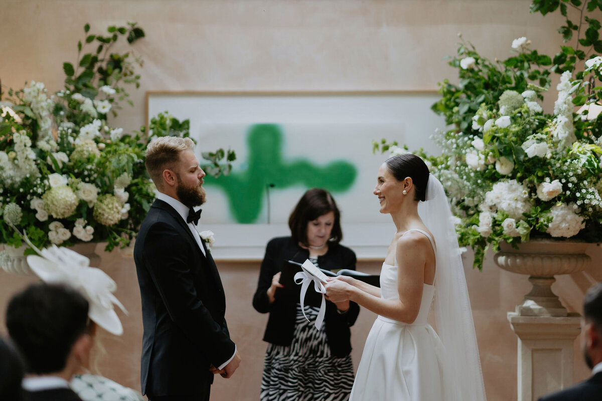 Bride and Groom making wedding vows in Garden Room Rectory Hotel 