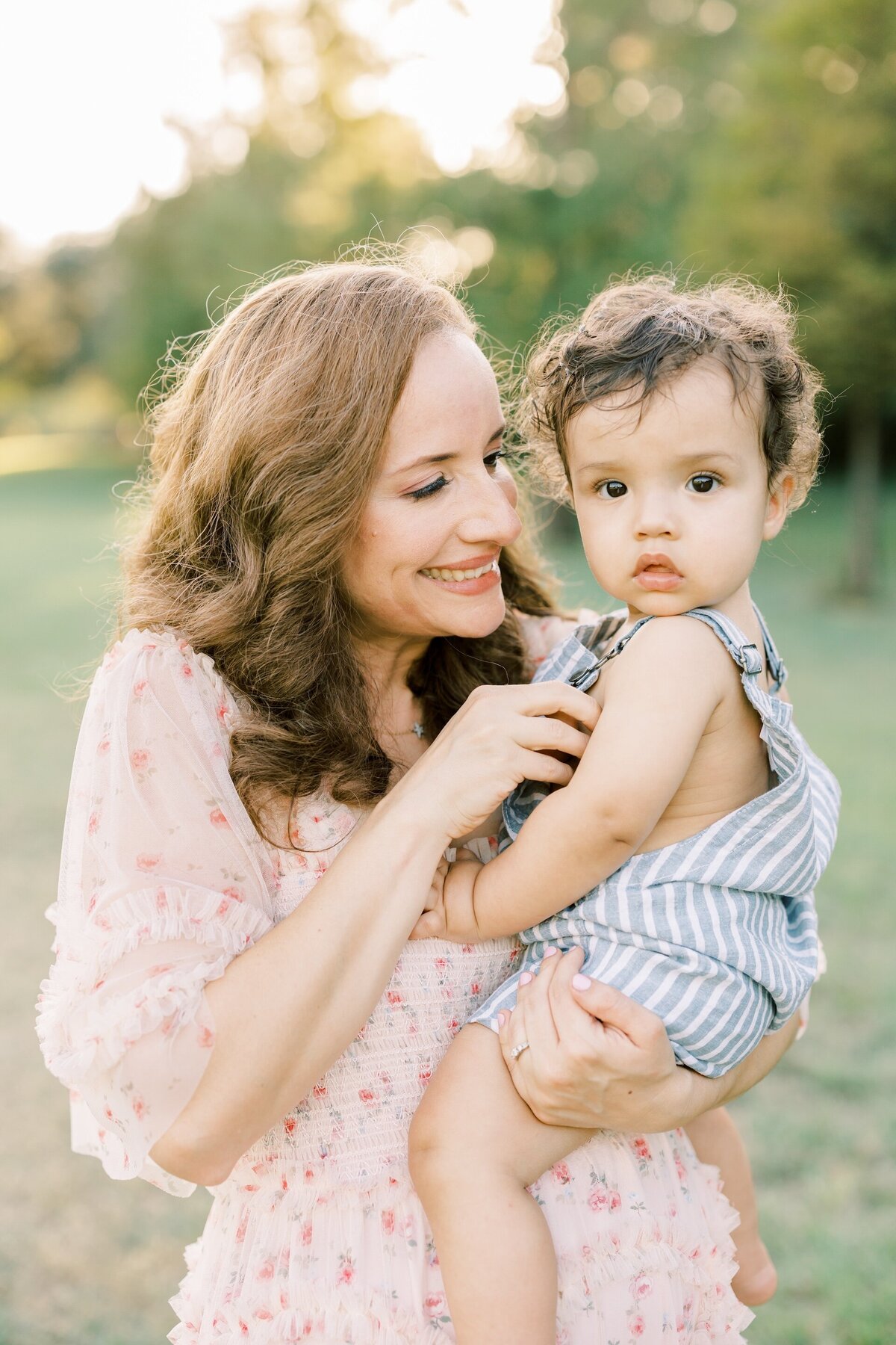 a mom holding her toddler