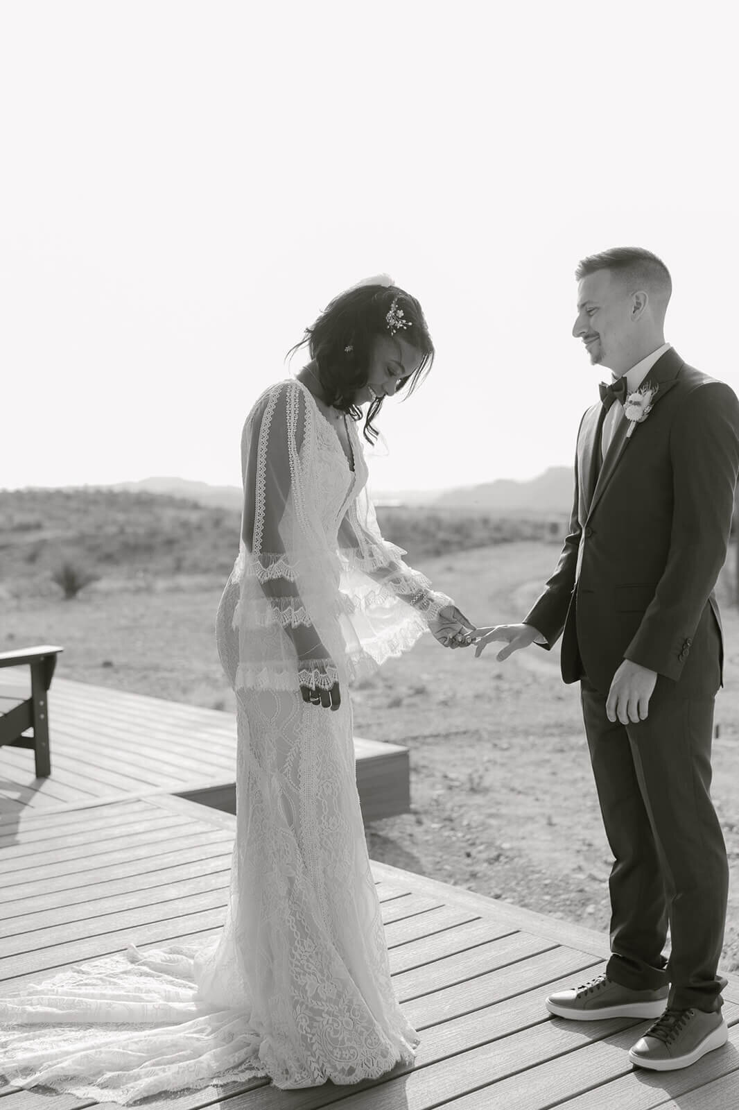couple holds hands during first look