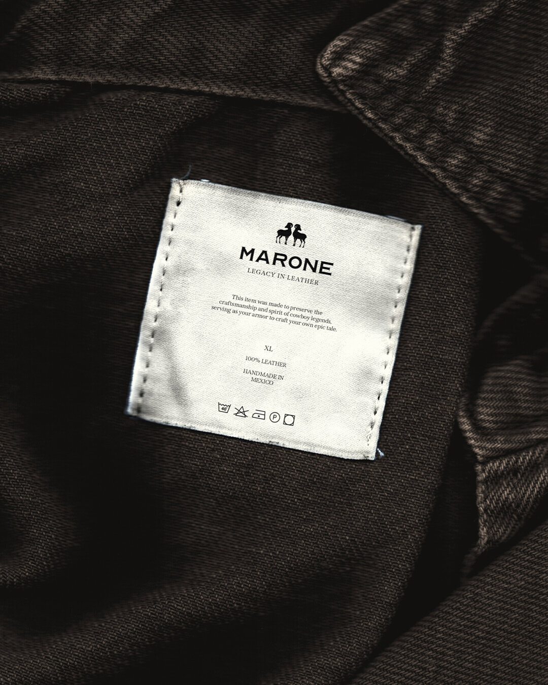 Luxury brand label design for Marone, showcasing timeless craftsmanship and branding for handmade leather apparel.