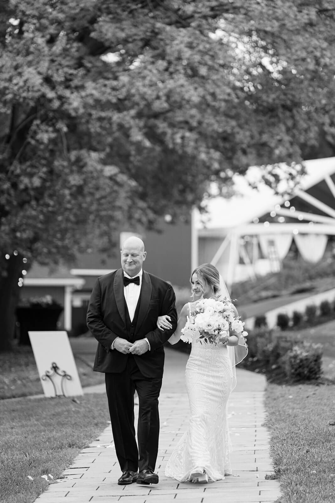 Bride walking down the aisle with father at Finger Lakes Wedding