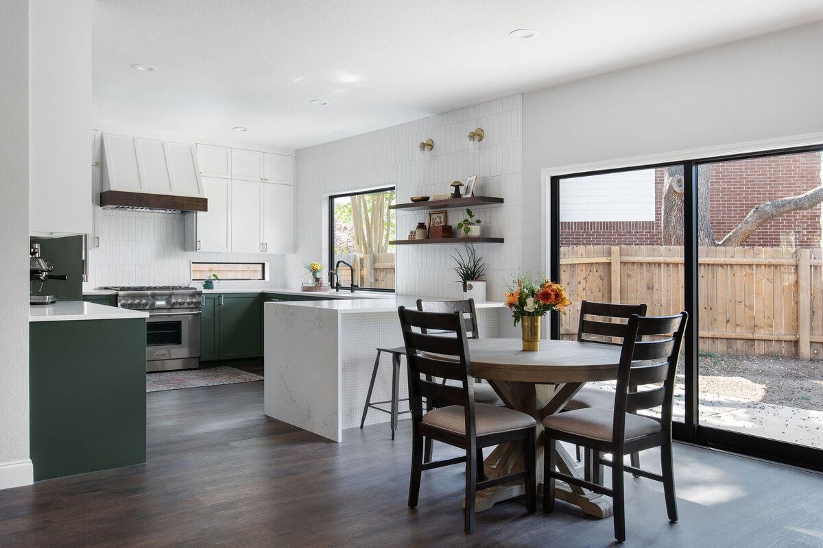 hello-home-austin-waterfall-peninsula-two-tone-kitchen-remodel-countertop-window-green-cabinets-tile-to-ceiling-1