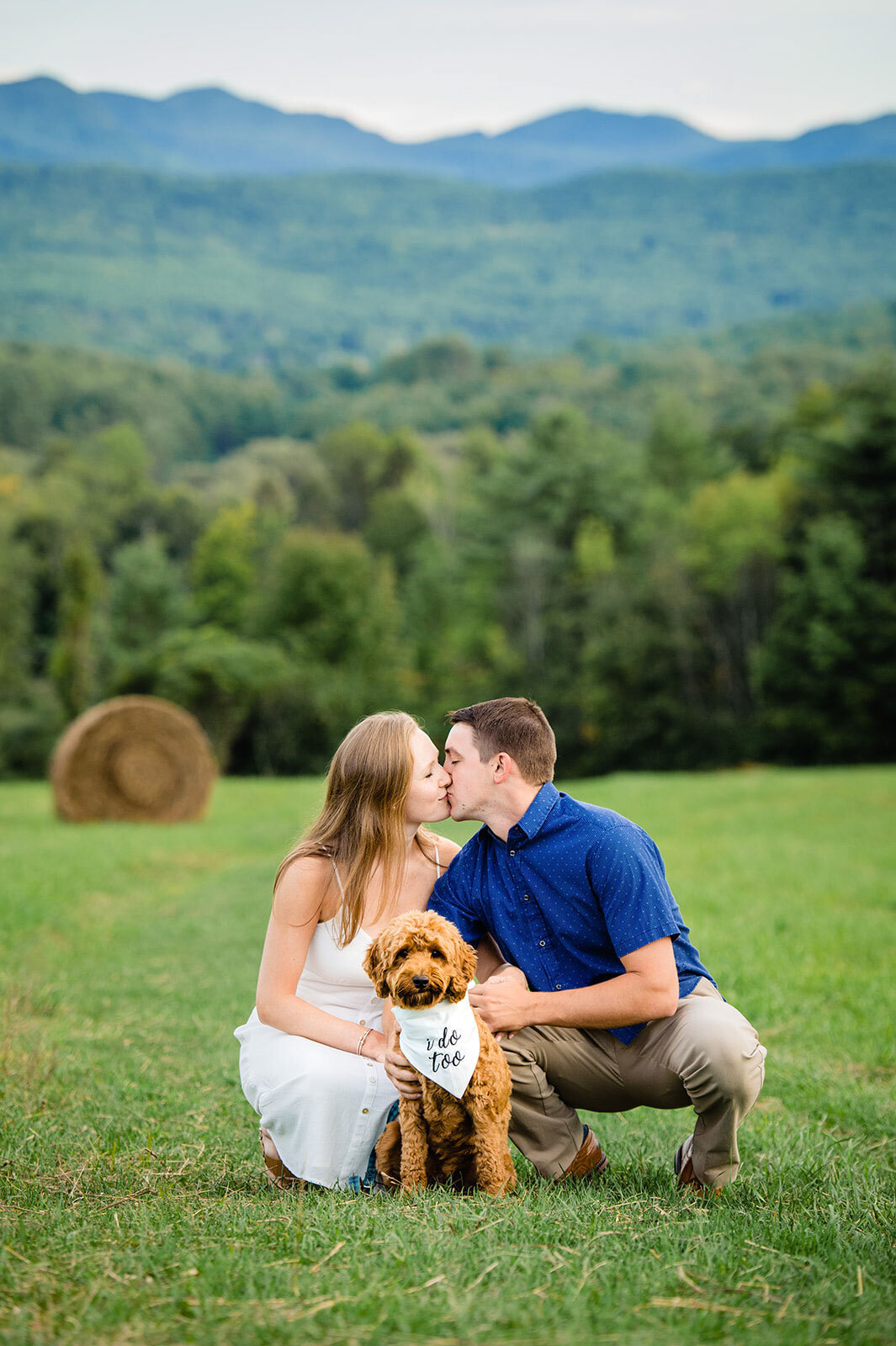 engaged couple with golden doodle dog lake bomoseen lodge